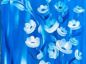 Elegant Blue Floral Wall Art featuring vibrant blue hues and delicate white flowers, perfect for enhancing home decor.